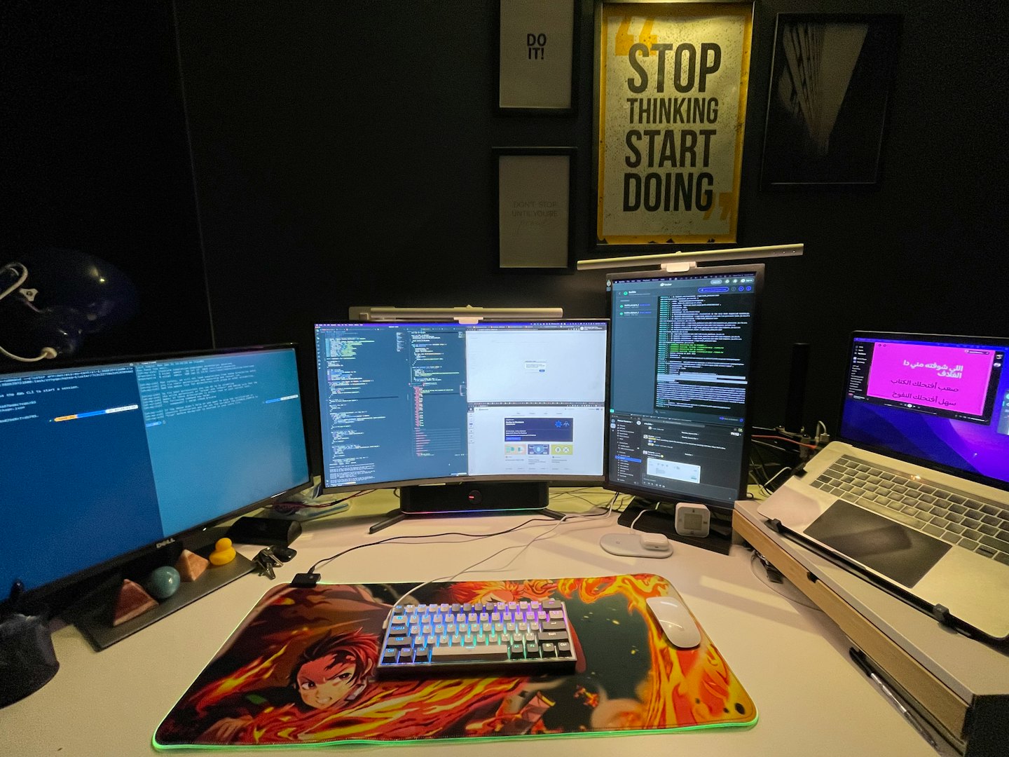 Three computer monitors displaying code on a modern desk.